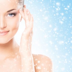 Spa portrait of young and beautiful woman over winter Christmas background